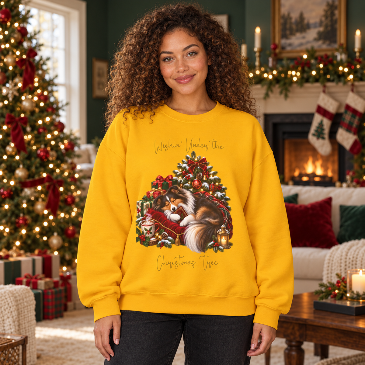 A woman wearing a bright yellow crewneck sweatshirt with a Christmas tree and sheltie graphic, standing in a cozy, decorated holiday living room.