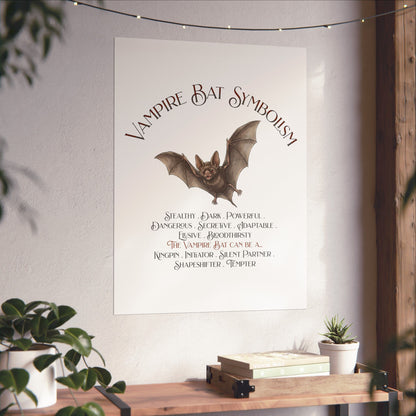 A vertical wall poster featuring 'Vampire Bat Symbolism' with an illustration of a bat and a list of symbolic qualities, displayed on a wall above a wooden console table with plants.