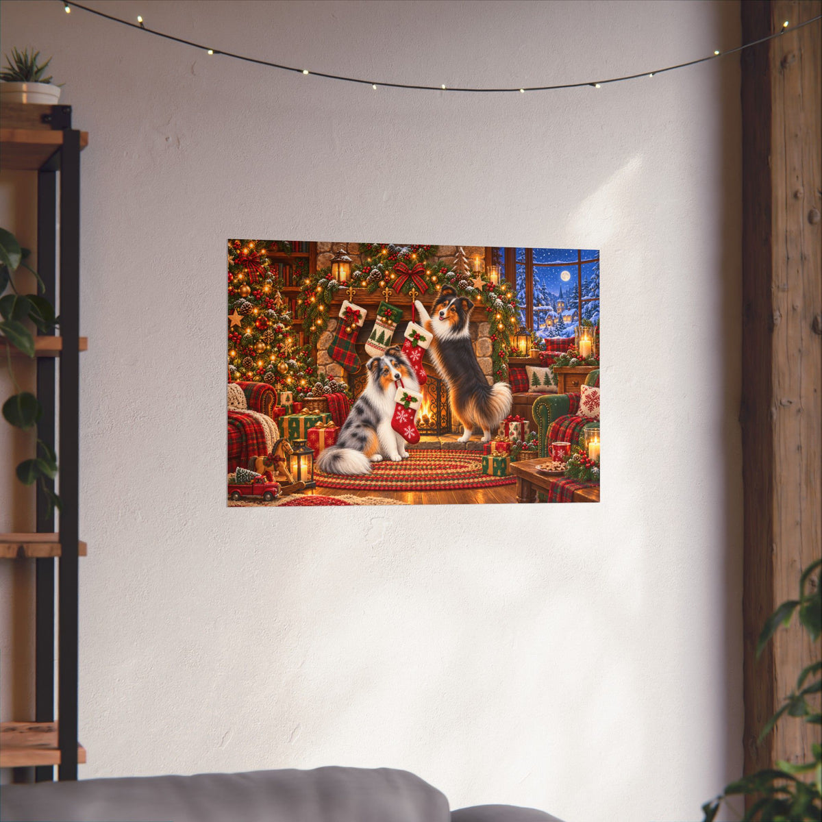 A rectangular wall art print showing two shelties hanging stockings in a cozy Christmas living room scene, displayed on a white wall above a sofa in a styled interior.